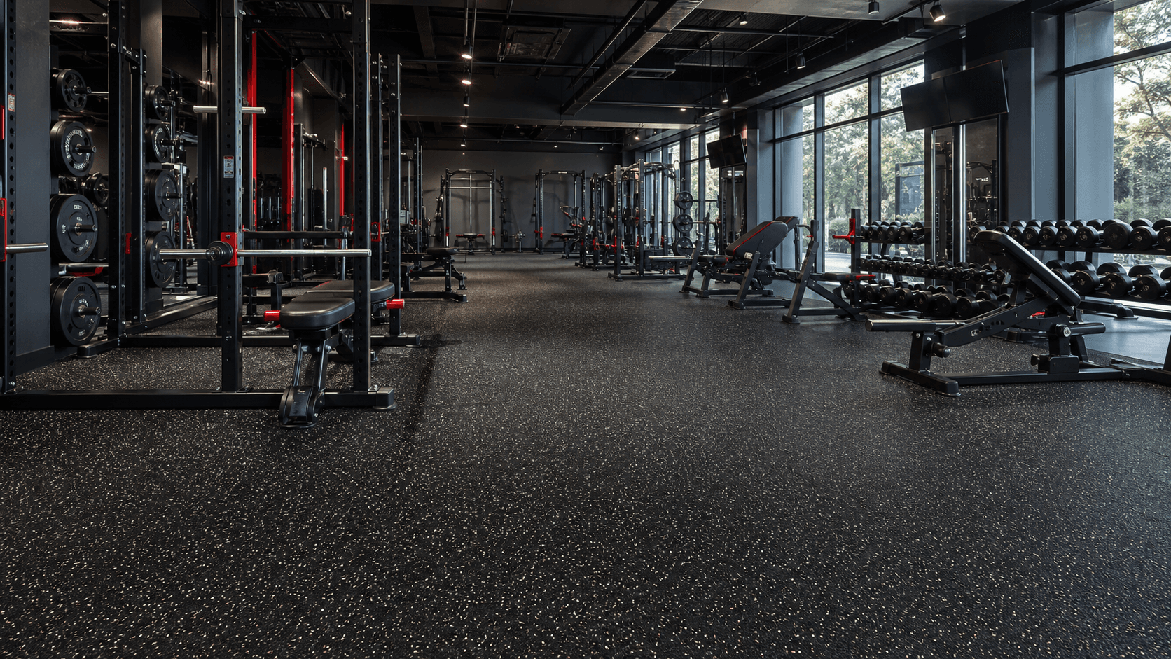 Commercial gym with black speckled rubber flooring